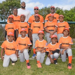 The Colina Tigers of JBLN’s coach-pitch division with Taige Adderley a representative from Colina.