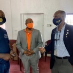(center) C. Kino McCartney, Branch Manager at Colina’s 21 Collins Avenue location converses with (l) Stephen Dean, President, Rotary Club of Nassau (RCN) and Michael V. Wilson, Administrative Director, (RCN).