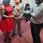 Maxine V. Seymour, Director, Corporate Communications at Colina speaks with a ZNS reporter as C. Kino McCartney, Branch Manager, 21 Collins Avenue, Colina looks on