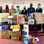 Pantry gets restocked ahead of Christmas. (l to r) Michael V. Wilson, Administrative Director, Rotary Club of Nassau (RCN); Samita Ferguson, Rotarian; Maxine V. Seymour, Director, Corporate Communications, Colina Insurance Limited (Colina) and Rotarian; C. Kino McCartney, Branch Manager, 21 Collins Avenue, Colina; Leila Greene, Volunteer and Director, The Bahamas Crisis Centre (BCC); Cleopatra Christie, Administrator, BCC; Stephen Dean, President, RCN; Chrislyn Skippings, Rotarian; and Jamal Davis, Community Service Director, RCN at The Bahamas Crisis Centre during the presentation.