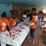 Employees of Colina’s Group and Health Department volunteering at The Bahamas Feeding Network on Valentine's weekend. AHVIA J. CAMPBELL