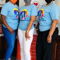 Beautiful in blue. (l to r) Linette Smith-Carey, Financial Services Representative; Andrea Davis-Rolle, Financial Services Representative; Denise Bethel, Office Administrator, Colina Insurance Limited strike poses in their R.E.A.C.H t-shirts.
