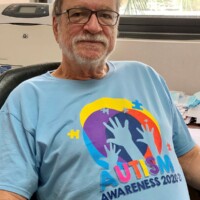 Leading the charge. Emanuel Alexiou, CEO, Colina Insurance Limited in his autism t-shirt.