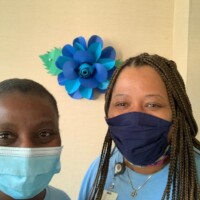 (l to r) DeAndrea Lewis, Vice President, Life Operations and Charmaine Parker, Manager, Customer Service bring awareness to autism.