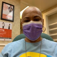 A blue mask too! Lavaughn Fernander, Colina’s Manager of Customer Service, simultaneously promotes autism and health safety with her R.E.A.C.H. t-shirt and blue face mask.