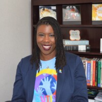 Bright in blue. Maxine Seymour, Director, Corporate Communications, Colina Insurance Limited in her autism t-shirt.