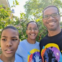 Paula Hospedales, Reinsurance Administration Manager; Marcus J. Bosland, Resident Actuary and their 12-year old son, Obasi Bosland, who is autistic.