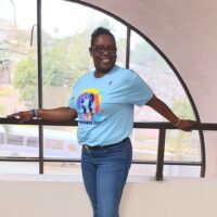 Sandra Smith, Sales Representative at 21 Collins rocks her blue shirt in style.