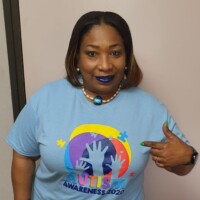 Sandra Walkes, Asst. Branch Manager, Collins in her autism awareness shirt.