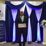 Dario Penn, Junior Internal Auditor, Colina Holdings Bahamas Limited receives an award for Distinguished Junior Internal Auditor at an event held to mark the 30th Anniversary of the Institute of Internal Auditors Bahamas Chapter