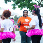 Anastacia Gray, Receptionist at Colina, congratulating Fun, Run, Walk participants on a job well done.