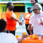 Sandra Smith, Sales Representative at Colina discussing healthy snack options with runners after the race.
