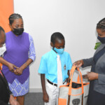 Maxine V. Seymour, Director, Corporate Communications, Colina presented Caiden Moxey with a gift bag from Colina, inclusive of Skullcandy Bluetooth earbuds.