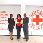 (l to r) Maxine V. Seymour, Director, Corporate Communications, Colina; Lisa Pinder, Director General, Bahamas Red Cross and Anthony Lonely, Sales Representative, Colina.