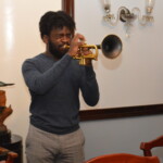 Anatole Bullard (center) accepts her award from Philip Smallwood, Director of Sales and Yvonne Gibson-Sands, Sales Manager.