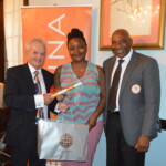 Taryn Nottage accepts her award from Philip Smallwood, Director of Sales (l) and Jeffrey Randall, Branch Manager (r).