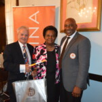 Sharon Strachan (center) receives her award from Philip Smallwood, Director of Sales and Jeffrey Randall, Branch Manager.