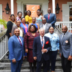 Philip Smallwood, Director of Sales and Clothie Lockhart, Sales Training Manager pictured with agents who received the GFSP designation