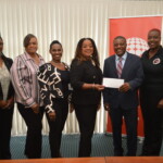 (l to r) Maxine V. Seymour, Director of Corporate Communications; Ethel Lightbourn, Office Administrator; Merranda Lowe, Unit Manager, Northern Branch; Sandradee Henfield, Branch Manager, Northern Branch; Zhivargo Laing, Founder, Bahamas Youth Leadership Development Program and La'Verne Gardiner, Bahamas Youth Leadership Development Program.