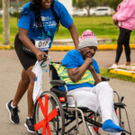 Christina Williams-Minnis, Sr. Group Service Administrator sprinting to the Pushathon finish line.