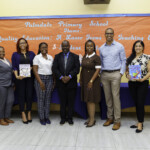 (l to r) Nurse Shaureen Hall, Supervisor, Medical Unit, Colina; Linique Gibson, Premium Accountant, Colina; D’Andra Johnson, Legal Counsel & Corporate Secretary, Colina; Diana Curtis, Literacy Coordinator, Palmdale Primary School; Dr. Clinton Josey Sr., Principal, Palmdale Primary School; Nathanria Williams, Vice Principal, Palmdale Primary School; Marcus Bosland, Resident Actuary, Colina; Sapna Chatlini, VP, Group & Health Benefits Department, Colina; Nyoshi Ward, Manager, Payments, Colina