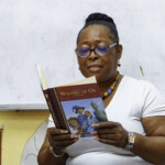 Nurse Shaureen Hall, Supervisor, Medical Unit, Colina reads an excerpt from the Wizard of Oz to students.