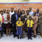 (front row, l to r) Nyoshi Ward, Manager, Payments, Colina and parent, Palmdale Primary School; Lashanta Smith, 1st Vice President, Rotary Club of Old Fort; April Knowles, Student, Palmdale Primary School; Senator Michela Barnett-Ellis; Nateisha Bain, President, Rotary Club of Old Fort; Dr. Clinton Josey Sr., Principal, Palmdale Primary School; Sienna Pratt, Student, Palmdale Primary School; Nathanria Williams, Vice Principal, Palmdale Primary School; Dorothea Whitlock, grandparent, Palmdale Primary School; Ryan Dumont, Student, Palmdale Primary School; Davette Lightbourne, Assistant. Treasurer, Rotary Club of Old Fort; Virginia Hall-Campbell, Community Volunteer; Linique Gibson, Premium Accountant, Colina; Diana Curtis, Literacy Coordinator, Palmdale Primary School
(back row, l to r) Ranard Henfield, attorney/former senator; Benjamin Bain, member, Rotary Club of Old Fort; Andrae Thompson, Treasurer, Rotary Club of Old Fort; D’Andra Johnson, Legal Counsel & Corporate Secretary, Colina; Marcus Bosland, Resident Actuary, Colina; Jathan Hall, Omega Psi Phi Fraternity Inc.; Lynden Rolle, Community Volunteer; Sapna Chatlini, VP, Group & Health Benefits Department, Colina