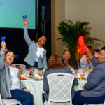 Colleagues cheer on the Northern Branch as they win the Unit Recruiting Award.