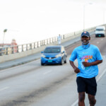 RayDon Poitier, Sales Manager, smiles victoriously after conquering the bridge.