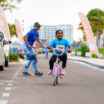 Young participant bikes her way to the finish line.