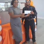 In Abaco, Verneisha Moore presents Wyton Smith with a gift certificate.