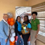 Lashanna Rolle of Rolle Town, Exuma, customer of both CIL and CGIA, receives a $100 Solomon’s voucher.