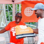 A happy customer is all smiles as he is handed a token of appreciation.