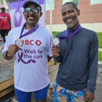 (l to r) Anthony “Tony” Longley, Sales Representative and RayDon Poitier, Sales Manager sport their medals after conquering the course.