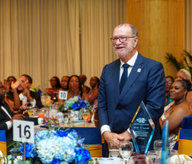 BIA Honouree and Colina CEO Emanuel M. Alexiou, stands in recognition of his outstanding contributions to the insurance industry during The Bahamas Insurance Association’s 50th Anniversary Banquet.