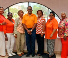 The agents at 21 Collins Avenue thought it important to show their support by wearing orange.