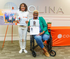 Erin Brown and her daughter Jupiter, excitedly displays their photo pages in the calendar.