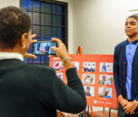 A proud family member captures the moment.