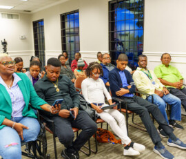 Those with hearing impairment use technology to follow the event.