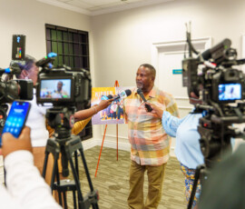 Kirkland Culmer, polio survivor, fields questions from news houses on inclusion in The Bahamas.