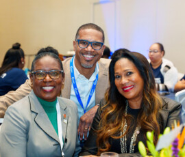 Sandra Smith and Bridegette Sands, sales representatives, are joined by Chief Operating Officer Marcus Bosland for a photo.