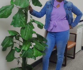 Customer Service Representative, Kandi Evans, strikes a pose for International Women’s Day.