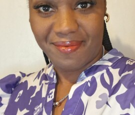 Sales Representative Fayedawn Russell, supporting women through the colour purple in Eleuthera.
