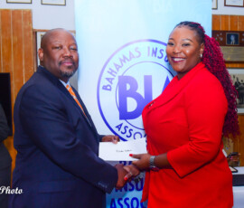 (l to r) Julian Rolle, BIA Chairman and Rishea Gibson-Conliffe, Supervisor Payment Center.