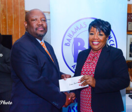 (l to r) Julian Rolle, BIA Chairman Susan Pennerman, Colina General.