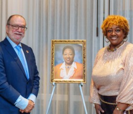 CEO Emanuel M. Alexiou and Hall of Fame Inductee, Lynette Thomspon, mark the occasion with a photo.