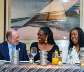 Top Producer of the Year (centre), Sandra Smith, shares a smile with Mr Alexiou.