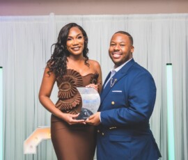 Machara Tucker (left), internal audit and compliance professional, Colina Insurance Limited, receives her IIA award from Leonardo Ferguson, Colina’s chief group internal auditor.