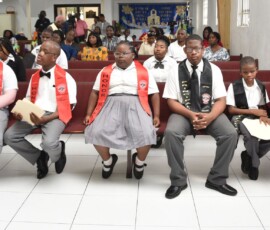 Awardees await the announcement of award recipients during the ceremony.