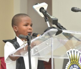 Khemar Davis leads the scripture reading during the ceremony.